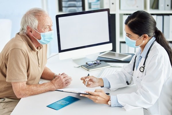 Elderly,Man,,Face,Mask,And,Doctor,In,Office,For,Results,